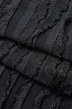 Robe longue noire ajustée vue de côté étoile
