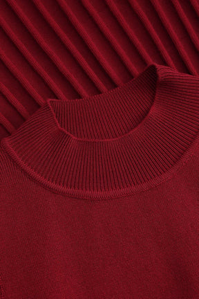 Robe longue tricotée rouge col montant vue de profil grâce