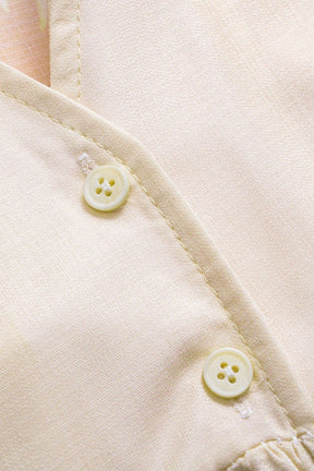 Détail col en V robe longue fleur