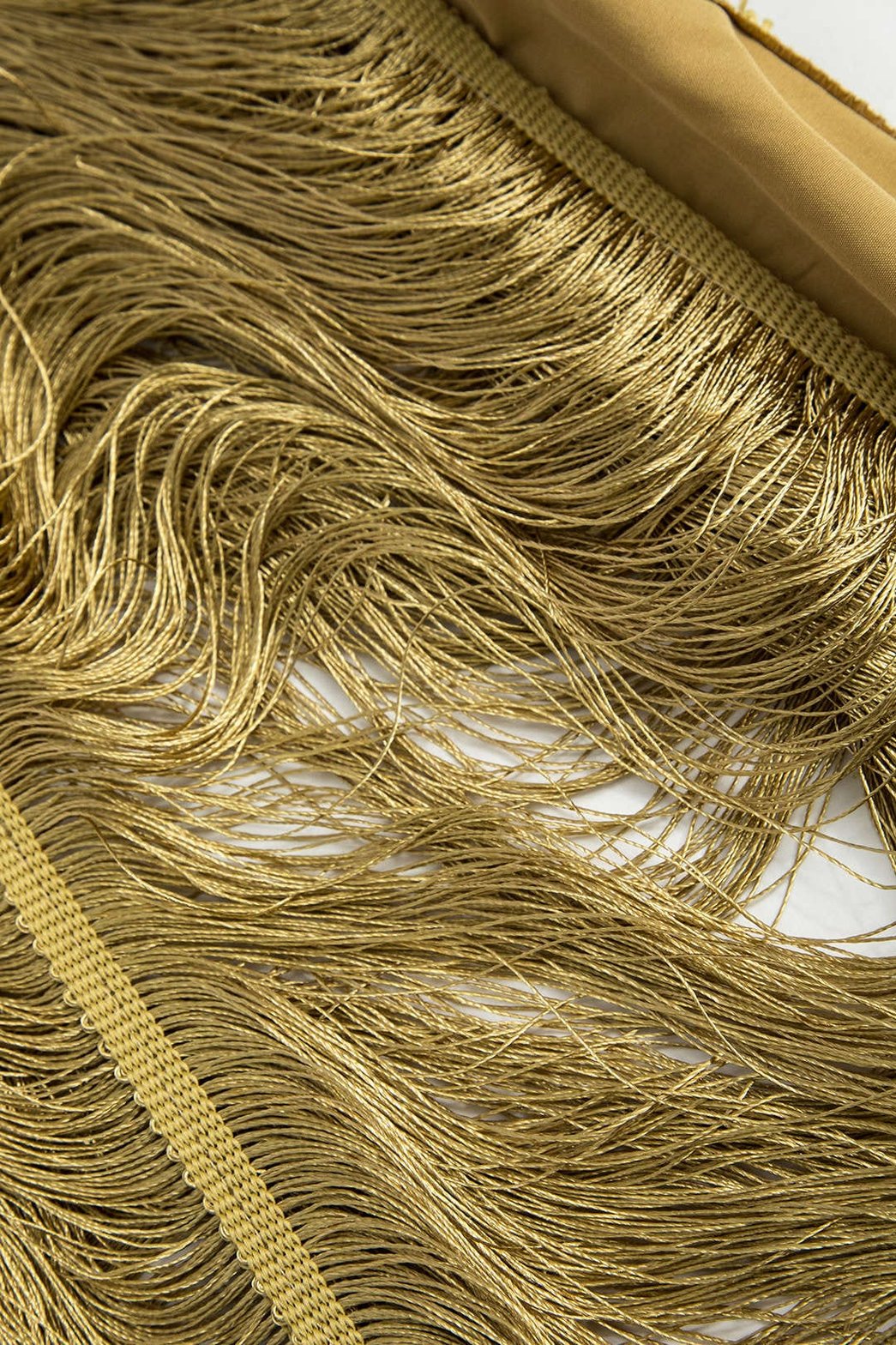 Détail des franges dorées lune