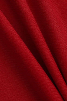 Robe moulante asymétrique rouge vue de dos étoile