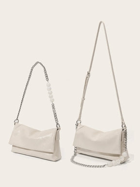 Sac bandoulière en cuir blanc cassé vue côté soleil