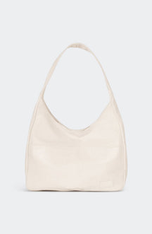 Sac bandoulière vintage porté épaule raffinement