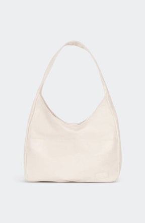 Sac bandoulière vintage porté épaule raffinement