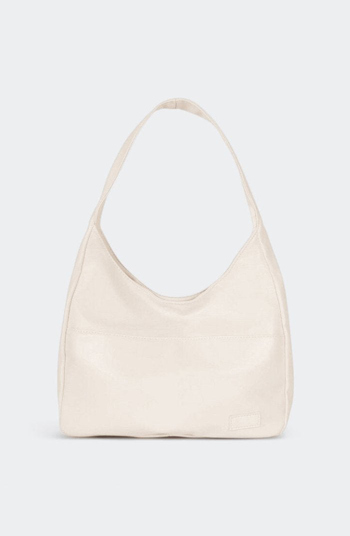 Sac bandoulière vintage porté épaule raffinement