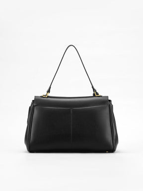 Sac à main noir détail bandoulière vent