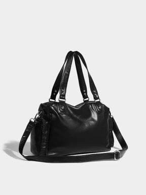 Sac en cuir noir vue arrière pluie