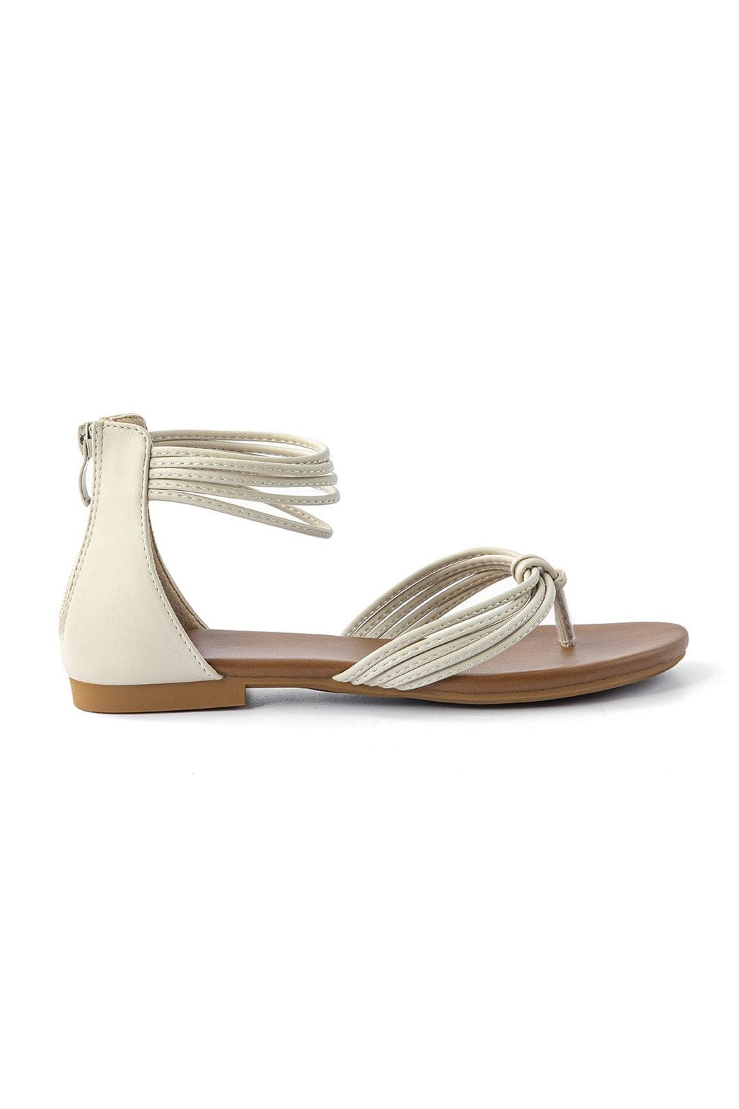 Vue latérale des sandales plates en cuir blanc étoile