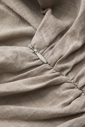 Top asymétrique beige en lin détail froncé brise
