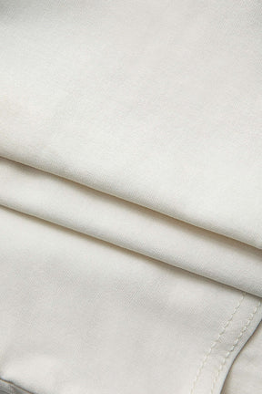 Top bustier blanc détails contrastés perle