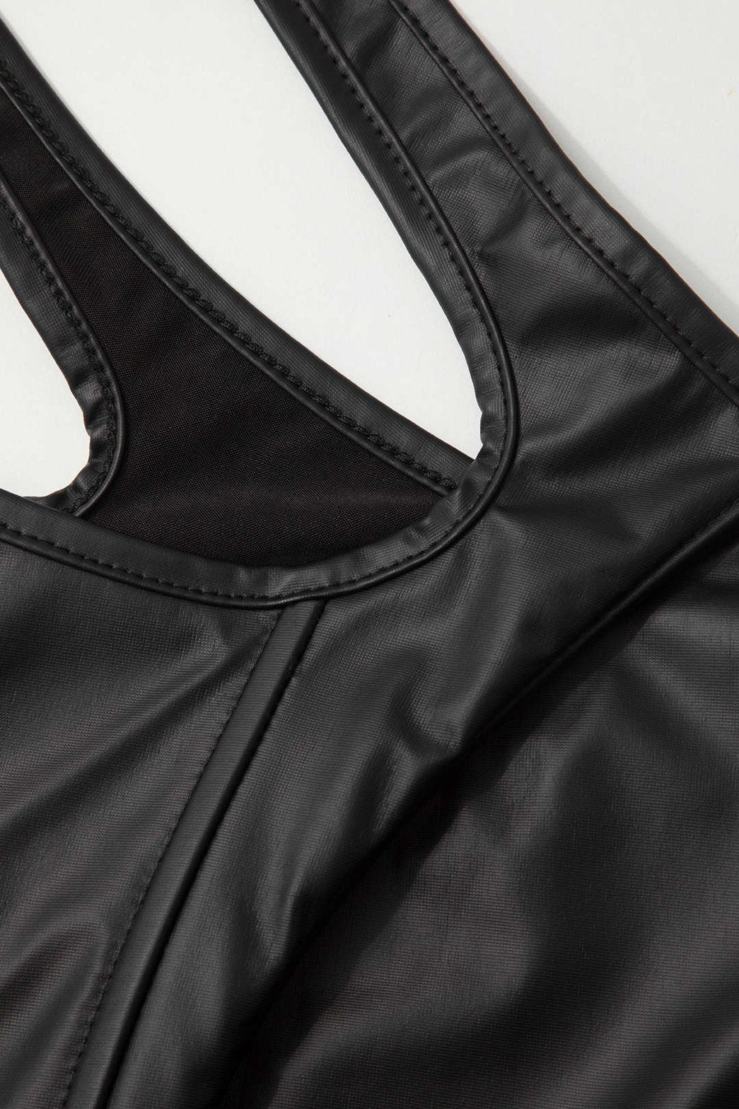 Top corset asymétrique noir détail soleil