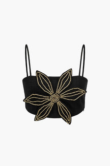 Top court noir à fleur dorée pailletée soleil