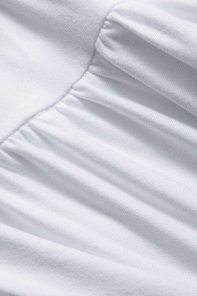 Top blanc manches longues vue rapprochée étoile