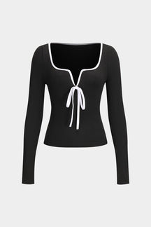 Top noir élégant avec nœud blanc décoratif papillon