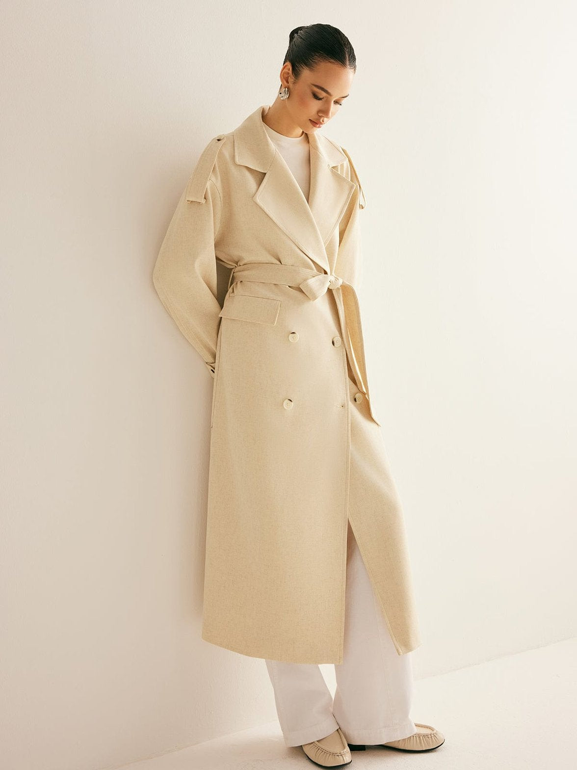 Trench beige détail des manches élégance