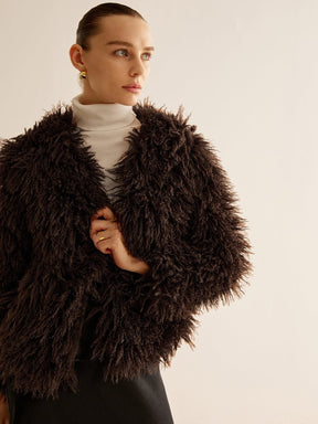 Veste fourrure synthétique marron détail finitions vent