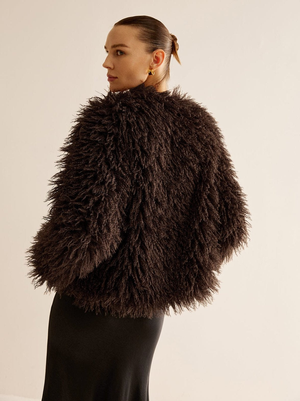 Veste fourrure synthétique marron détail texture étoile