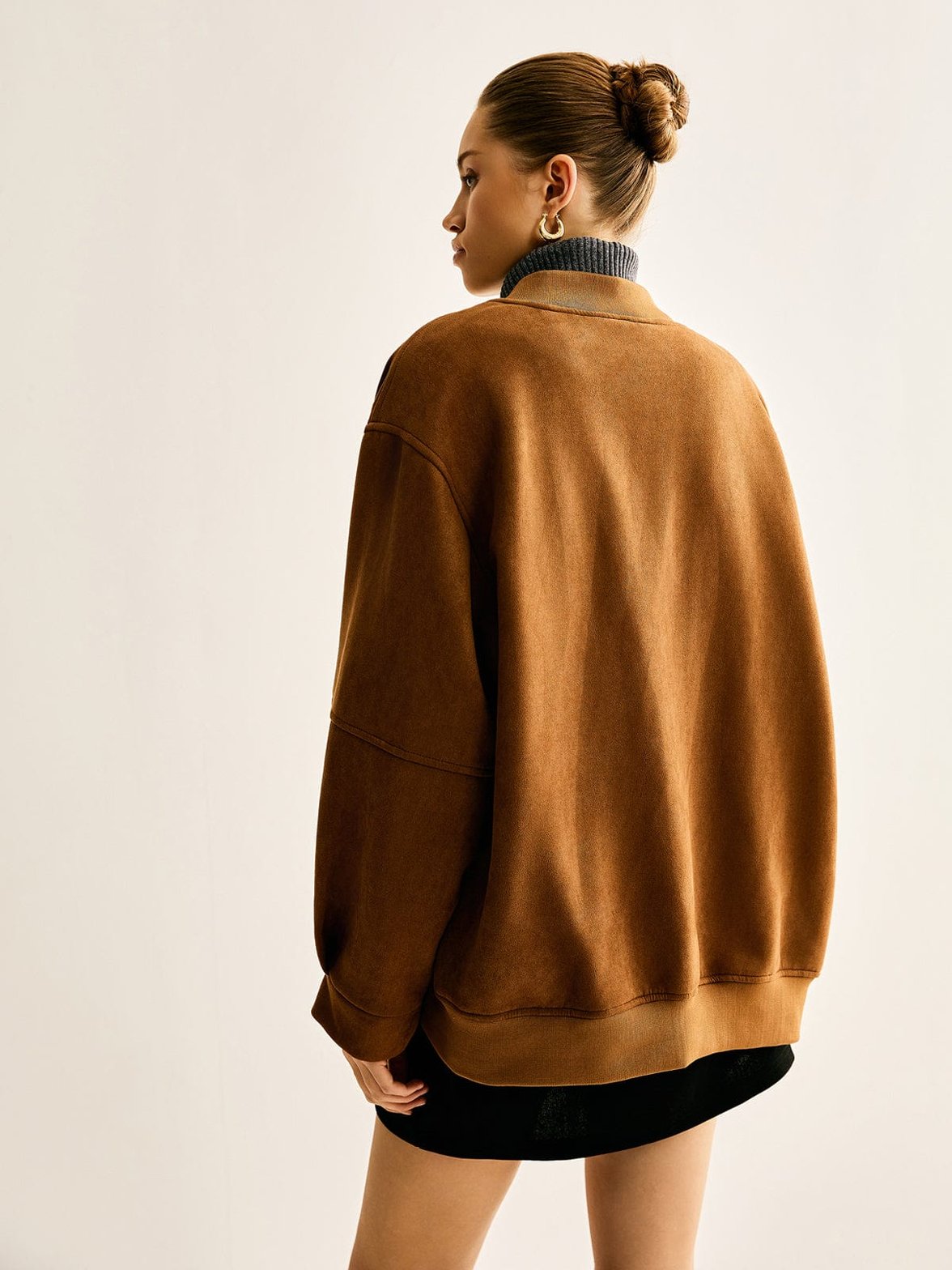 Veste en simili cuir détail des finitions jade