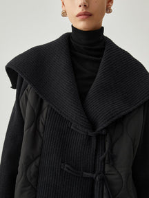 Veste noire matelassée col tricot élégante douceur