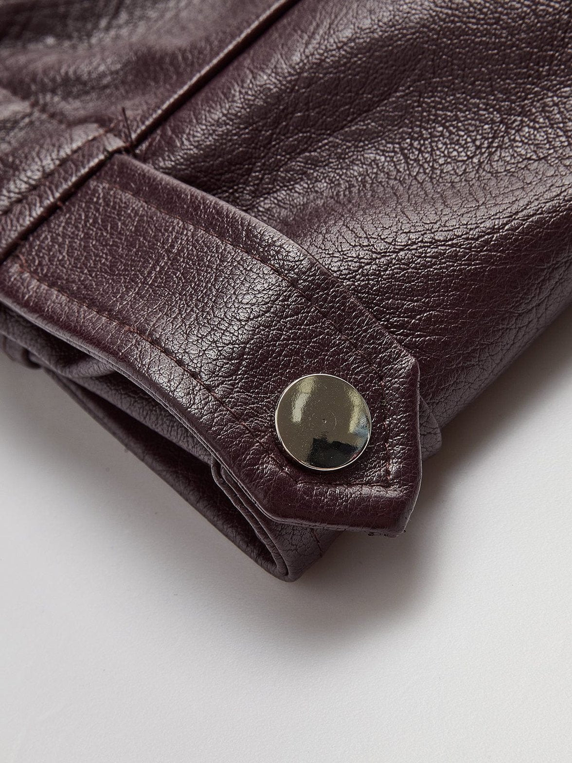 Veste simili cuir marron détail manche pluie
