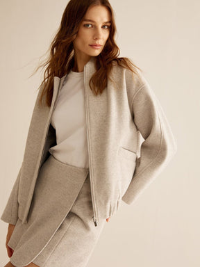 Veste tweed beige détail matière lumière