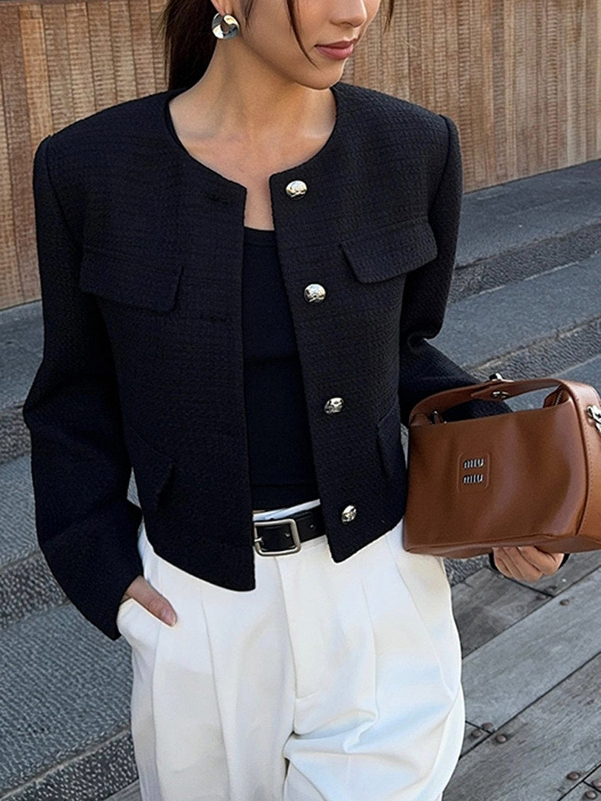 Veste tweed noire portée sophistication
