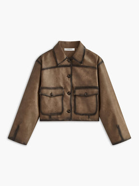 Veste vintage en simili cuir marron vue de face soleil