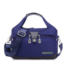 Sac bandoulière bleu marine jolieandjuliette multi-poches avec détails argentés élégant