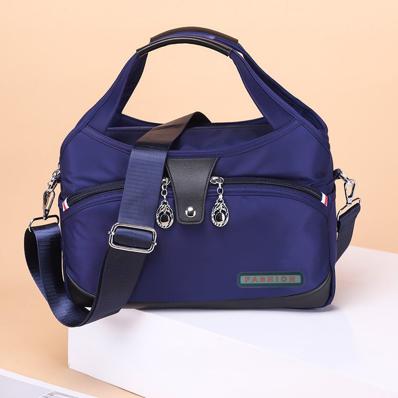 Sac bandoulière bleu marine jolieandjuliette multipoches pratique femme voyage