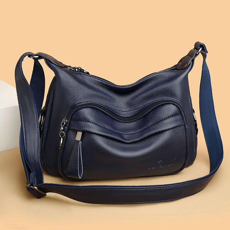 Sac bandoulière bleu marine jolieandjuliette en cuir avec multiples poches zippées