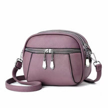 Sac bandoulière cuir mauve jolieandjuliette compact avec multiples zips et bandoulière ajustable