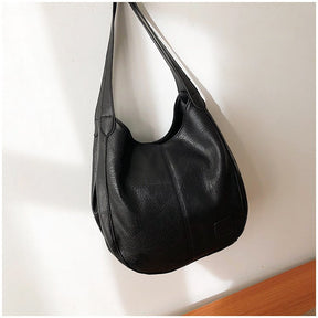 Sac bandoulière cuir noir jolieandjuliette style hobo texture grainée élégant femme