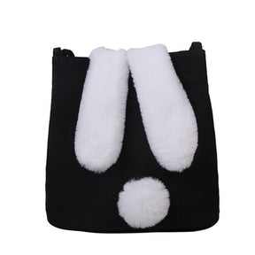 Sac bandoulière noir jolieandjuliette avec oreilles de lapin blanches et pompon décoratif