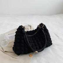 Sac bandoulière noir tricoté élégant jolieandjuliette texture unique fermeture éclair dorée