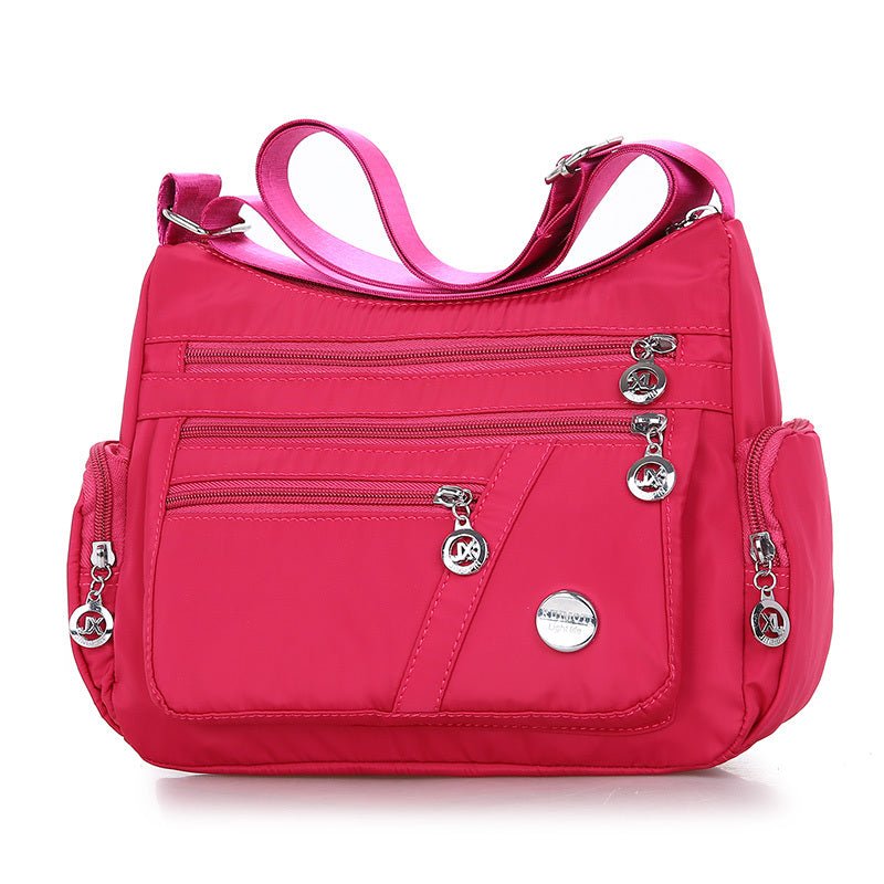 Sac bandoulière rose fuchsia jolieandjuliette multi-poches léger pour femme