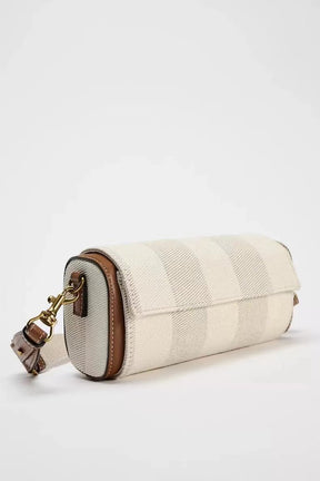 Sac bandoulière jolieandjuliette en toile rayée beige et détails cuir cognac