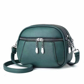 Sac bandoulière vert émeraude jolieandjuliette compact en cuir zippé élégant