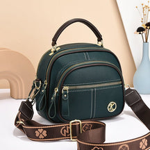 Sac bandoulière vert foncé jolieandjuliette compact multi-poches avec bretelle décorative