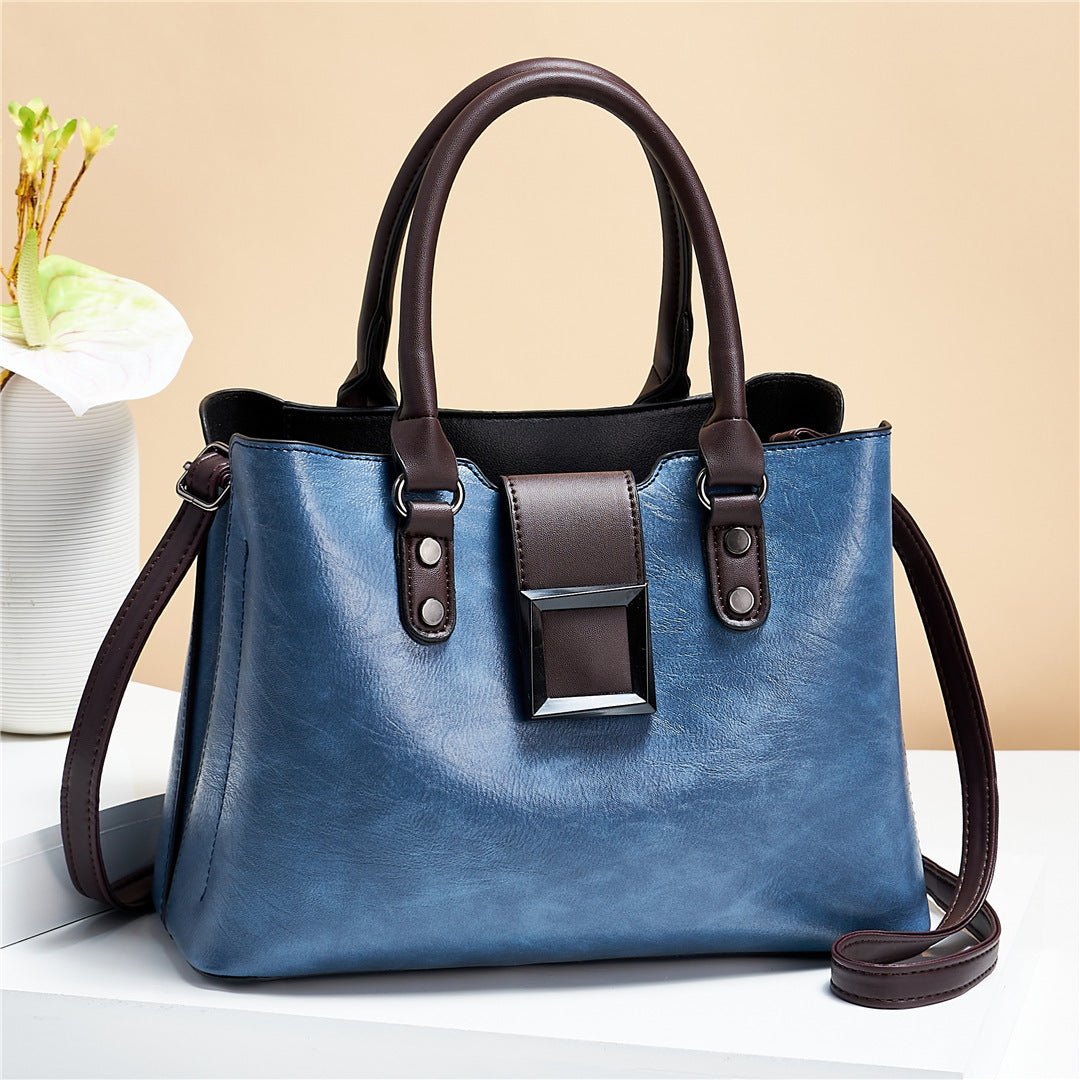 Sac à main bleu cuir jolieandjuliette avec boucle marron et poignées élégantes