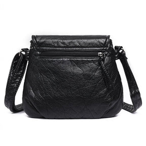 Sac bandoulière cuir noir jolieandjuliette compact texture grainée femme élégant