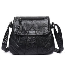 Sac bandoulière cuir noir jolieandjuliette texture granulée poche avant fermoir élégant