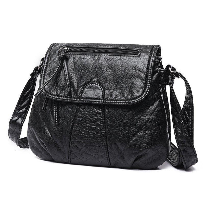 Sac bandoulière cuir noir texturé jolieandjuliette avec fermeture zippée et rabat