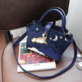 Sac à main bleu marine jolieandjuliette motifs célestes étoiles lune élégant bandoulière amovible