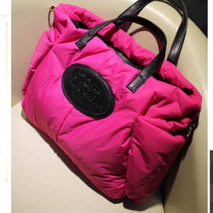 Sac matelassé rose vif jolieandjuliette logo noir poignées cuir élégant