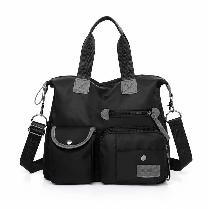 Sac multipoches noir jolieandjuliette en nylon avec bandoulière amovible et poches extérieures