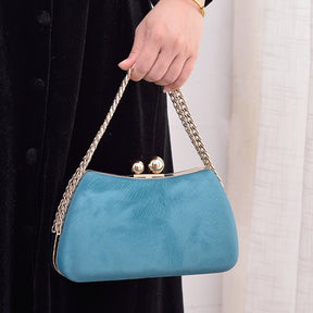 Sac pochette bleu ciel jolieandjuliette avec chaîne dorée et fermoir boule élégant