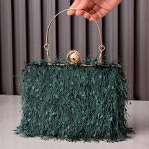 Sac de soirée vert émeraude à plumes jolieandjuliette avec poignée dorée élégant