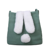 Sac jolieandjuliette en toile verte avec oreilles et queue de lapin blanches