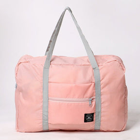 Sac de voyage pliable rose jolieandjuliette avec poignées grises et poche zippée