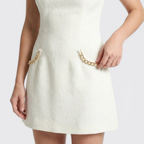 Mini-robe de cocktail taillée ornée de perles avec poches femme